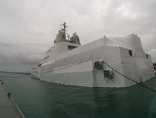 Load image into Gallery viewer, Russian Super Yacht 'A' came to New Zealand for a refit.  North Shore Scaffolding was commissioned to install scaffolding to allow paintwork on 2/3's of the hull. We then Shrink Wrapped it all.
