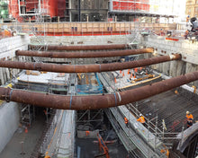 Load image into Gallery viewer, Layher Allround Scaffolding walkways, construction access stairs and scaffolds built by North Shore Scaffolding underneath Lower Queen Street, between Central Post Office (Britomart Station) and H&amp;M, as part of the City Rail Link (CRL).
